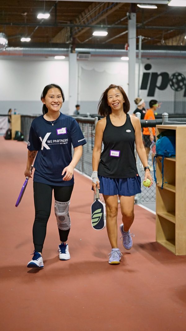 Walking off the court together, still smiling from the last point.