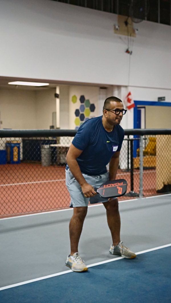 Crouched, focused and ready for whatever comes over the net.